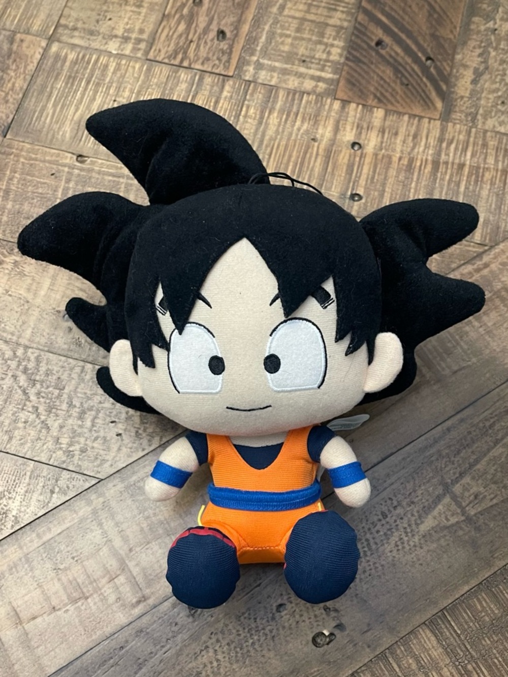 an 8-inch Goku sitting plush from the Dragon Ball Z series